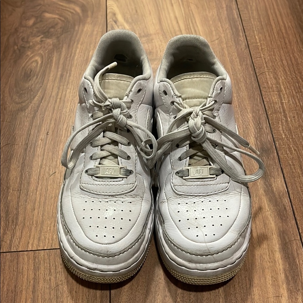 Nike White Sneakers with Leather Upper and Ventilated Design
